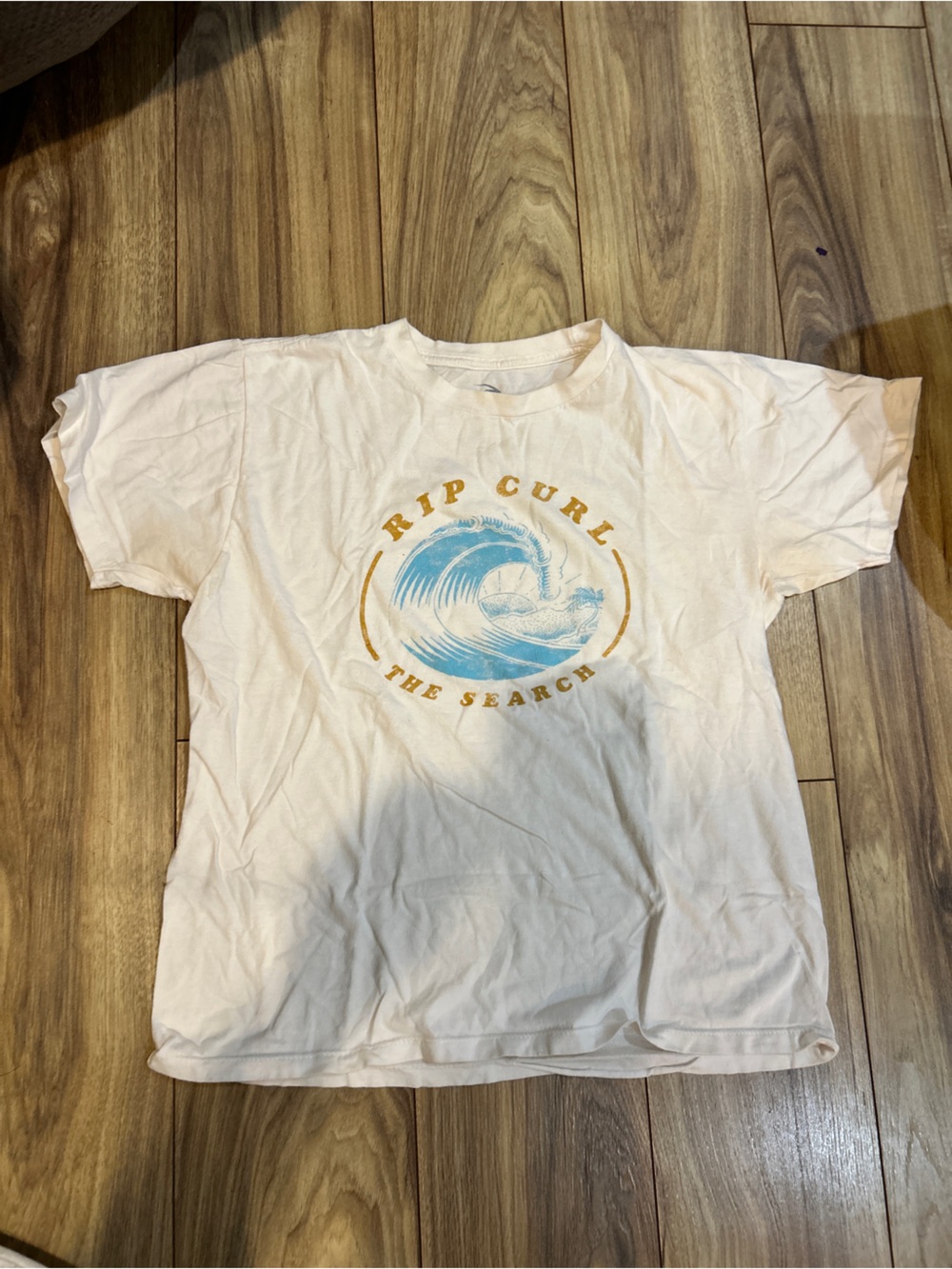 Rip Curl Cream Tee with Blue and Gold Wave Graphic